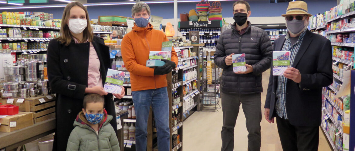 Three generations of the Askew family, Claire and her son Joseph on the left and David on the right, are joined by Phil McIntyre-Paul, Project Manager and Alex de Chantal, Fundraising Strategy Coordinator of the Shuswap North Okanagan Rail Trail as they show off the specially commissioned winter greeting cards available at all four locations of Askew’s Foods.